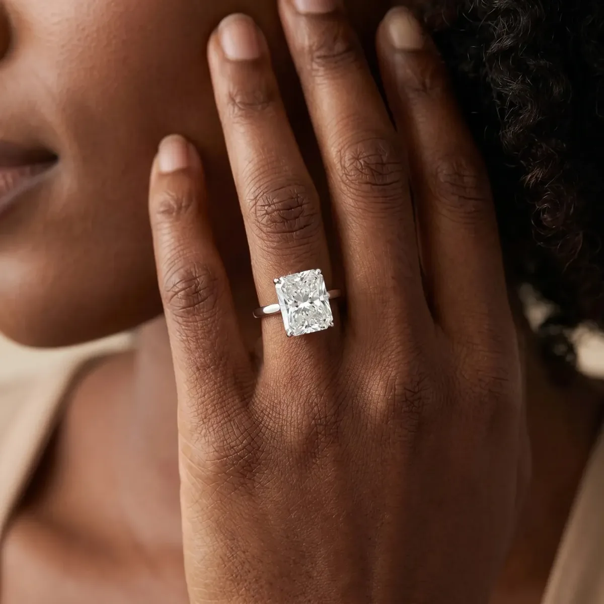 Radiant Cut Cut Solitaire Engagement Ring with Four-Prong Setting on a Classic Band Platinum