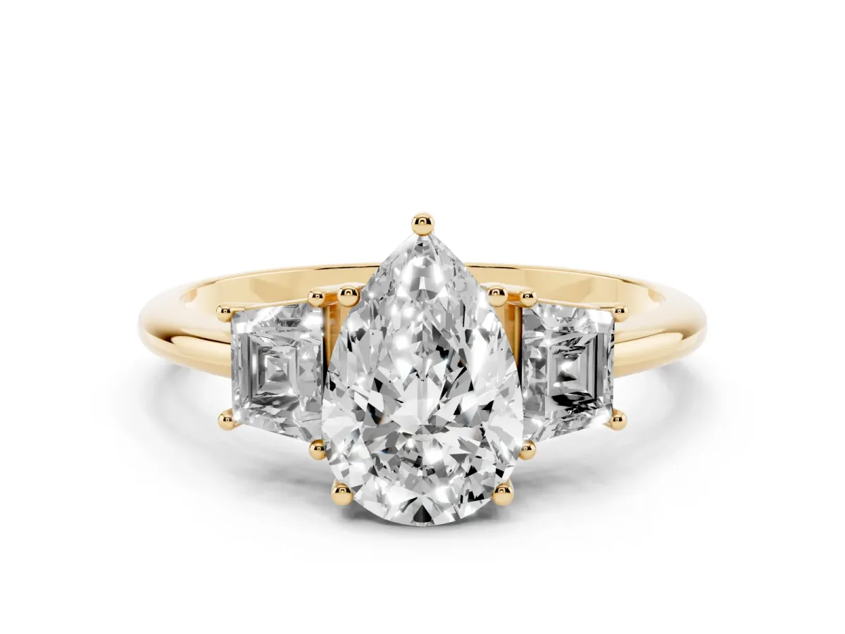 Pear Cut Diamond Three-Stone Ring with Trapezoid Side Stones and Prong Setting Yellow gold