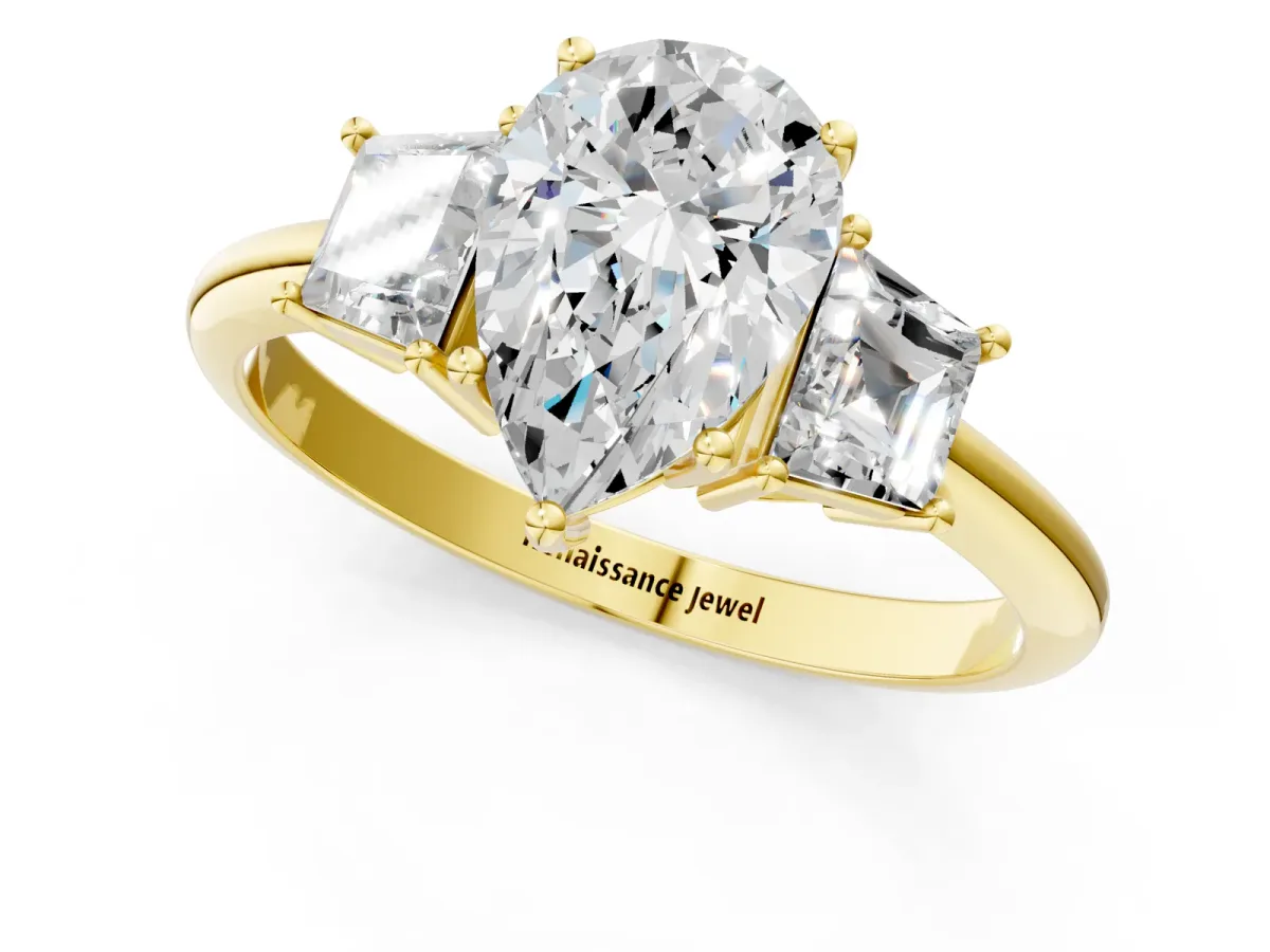 Pear Cut Diamond Three-Stone Ring with Trapezoid Side Stones and Prong Setting Yellow gold