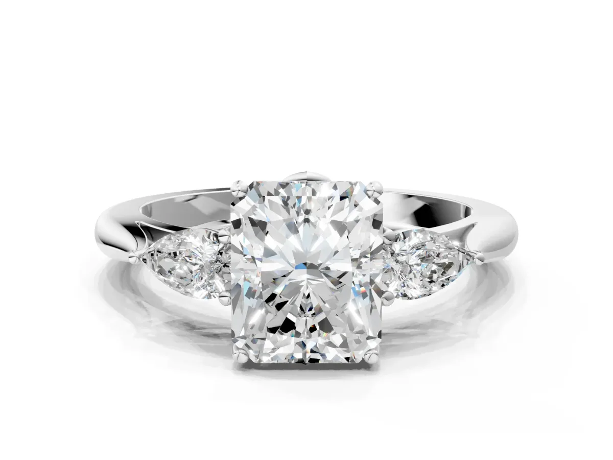 Three-Stone Radiant Cut Diamond Ring with Pear Side Stones in Four-Prong Setting Platinum