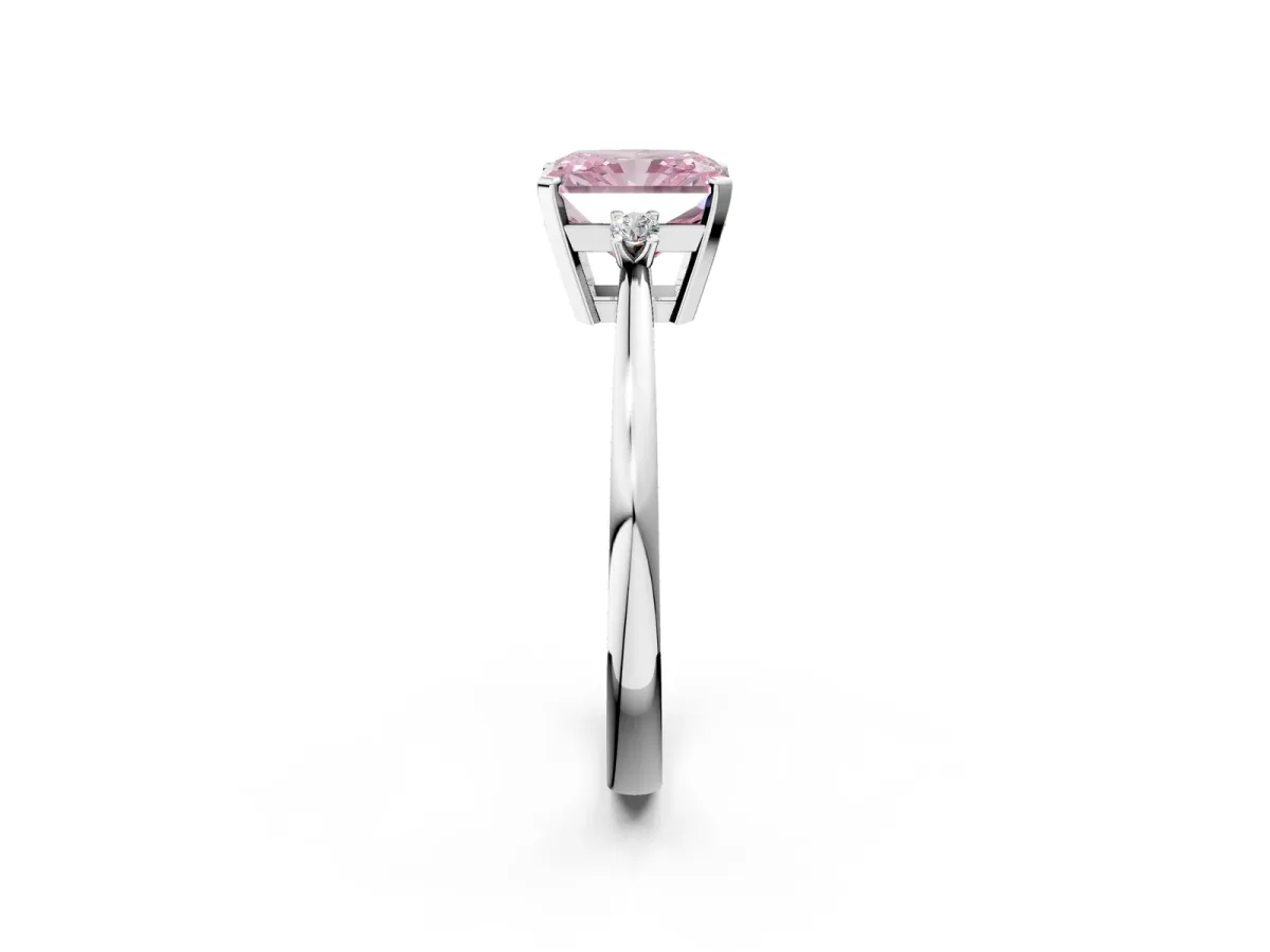Fancy Pink Radiant Cut Cut Three-Stone Solitaire Ring with Round Accent Diamonds and Four-Prong Setting Platinum