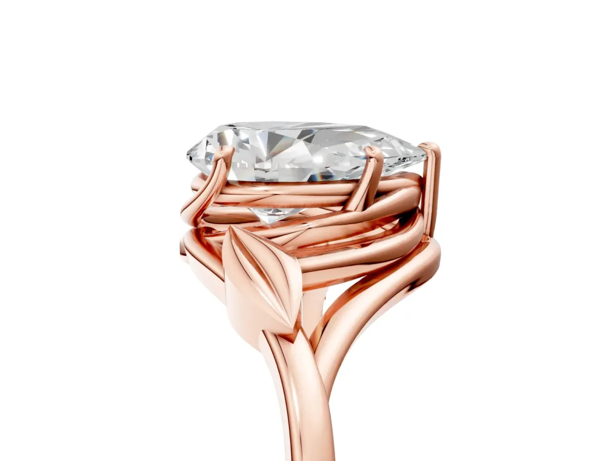 Pear Cut Diamond Solitaire Ring with Twist Band and Four-Prong Setting Rose gold
