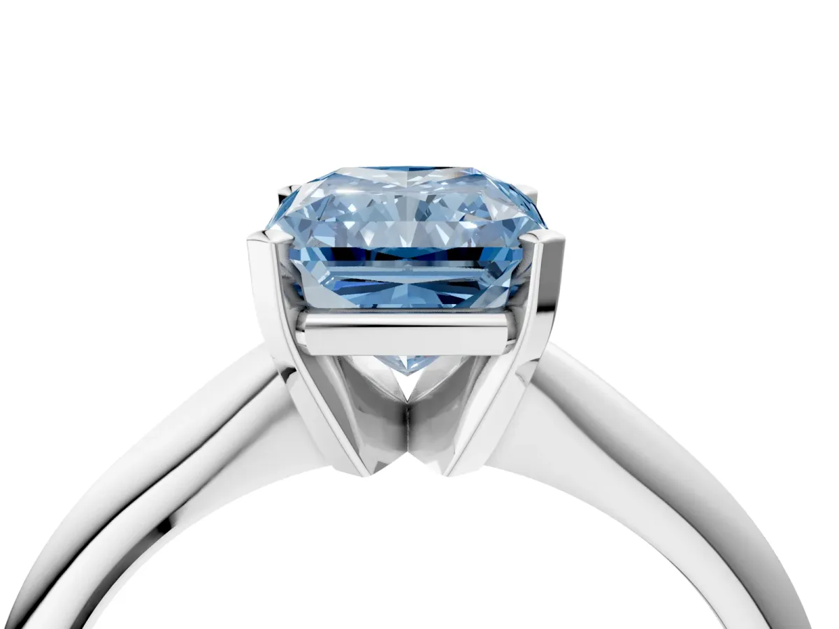 Fancy Blue Radiant Cut Cut Solitaire Ring with Four-Prong Setting on a Classic Band Platinum