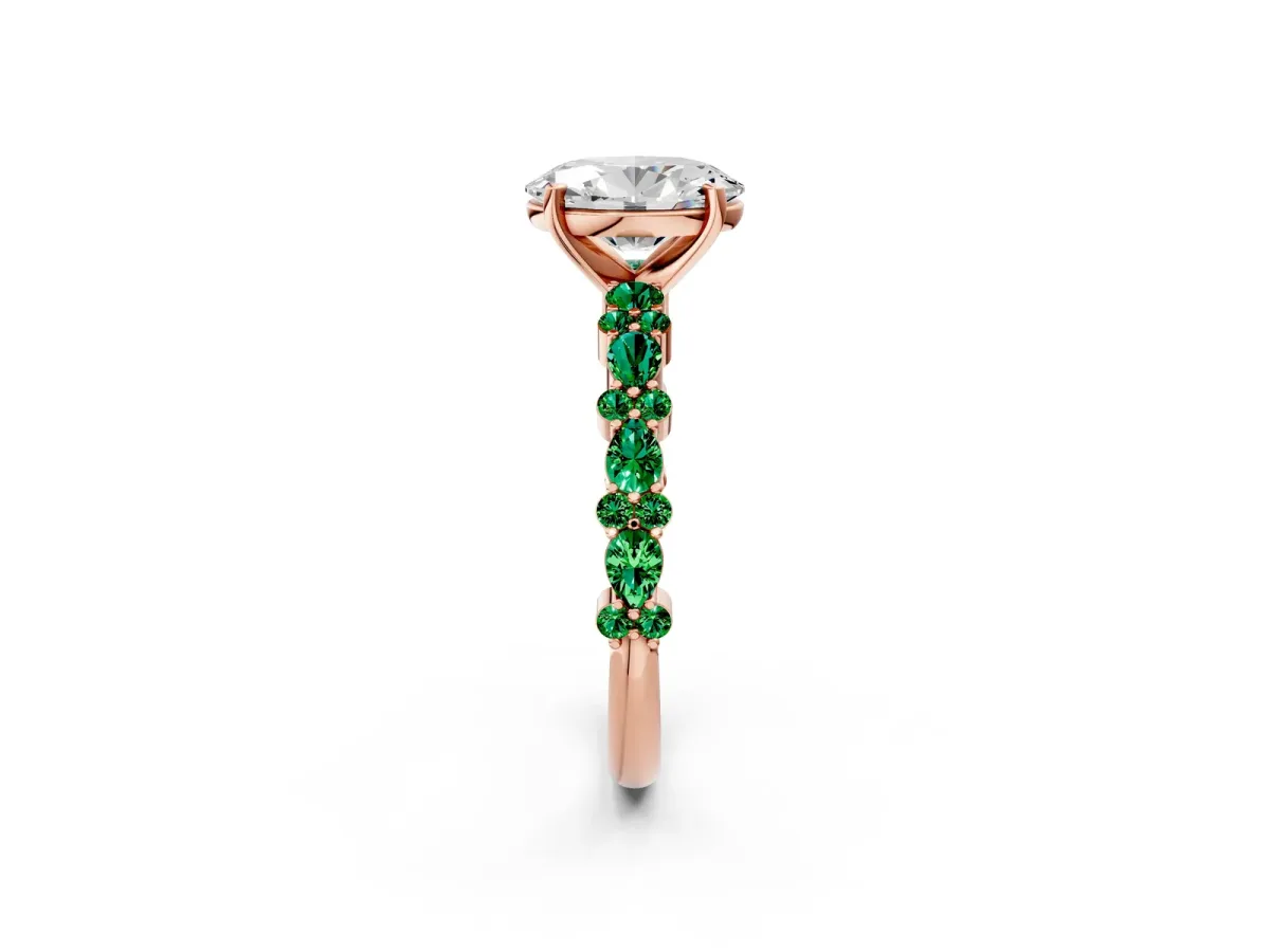 Oval Cut Diamond Side Stone Solitaire Ring with Round Emerald and Four-Prong Setting Rose gold