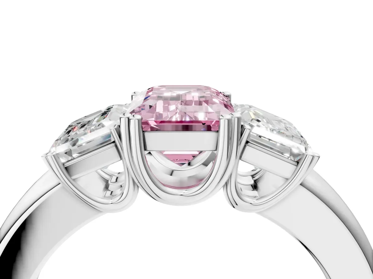 Fancy Pink Three-Stone Emerald Cut Cut Diamond Ring with Channel Set Band and Four-Prong Setting Silver