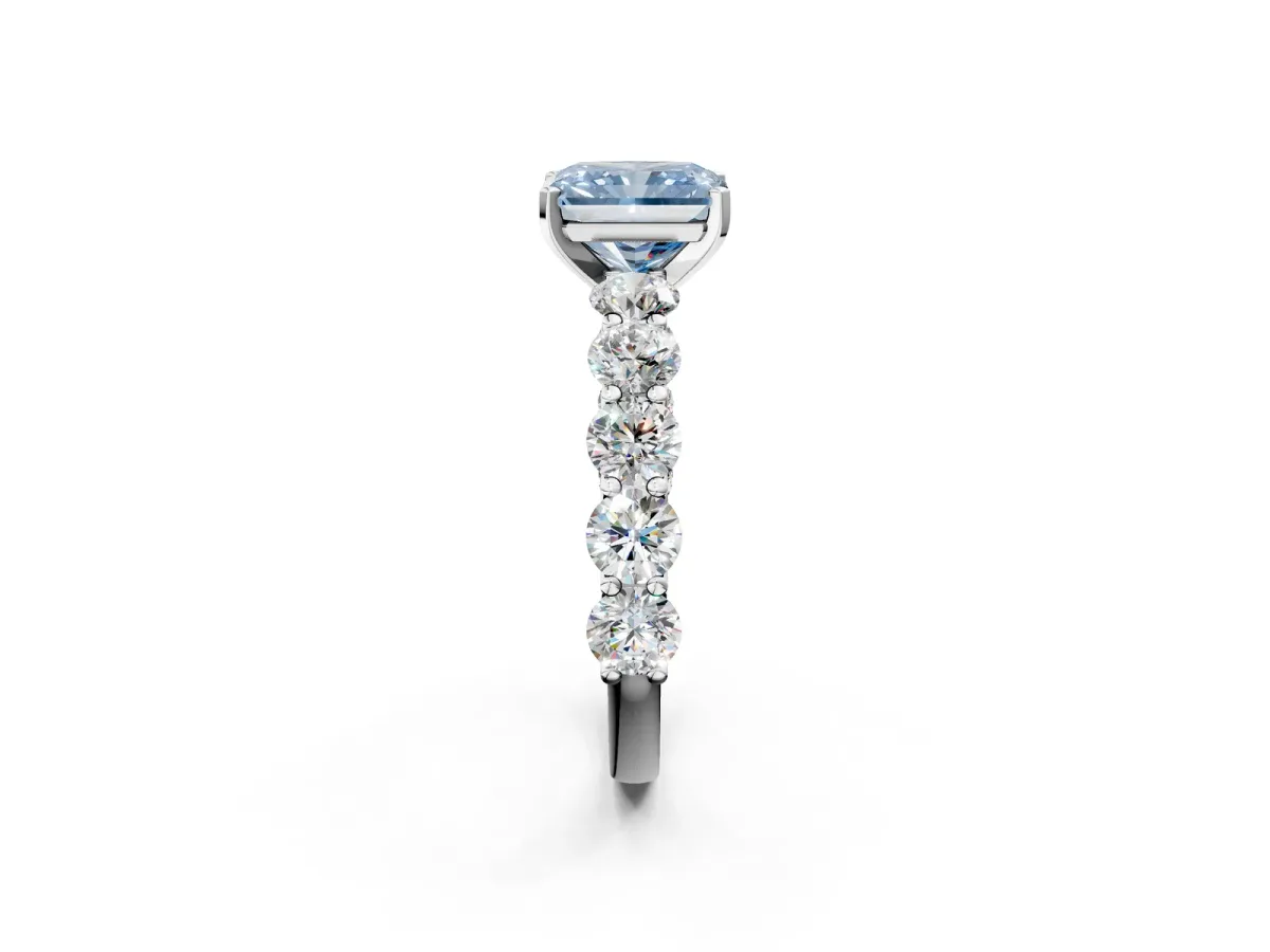 Fancy Blue Radiant Cut Diamond Prong Setting with Side Stones on a Pave Band Silver