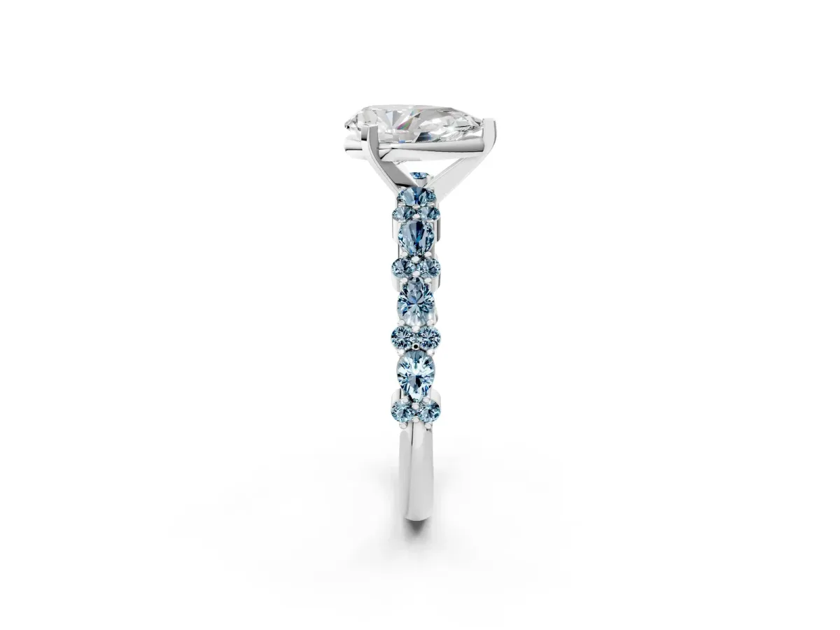 Pear Cut Diamond Side Stone Solitaire Ring with Round Aquamarine and Four-Prong Setting Silver