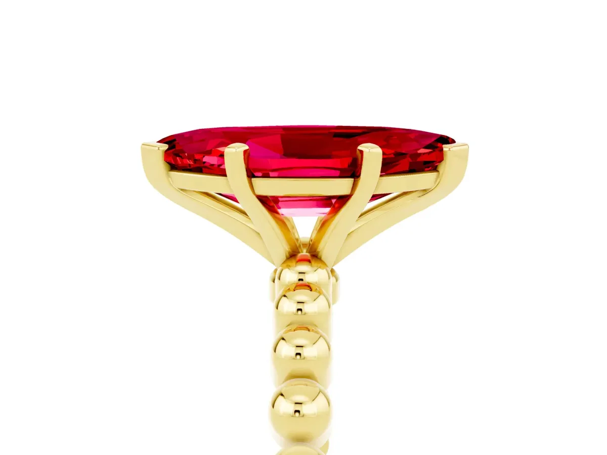 Marquise Cut Ruby Solitaire Ring with Beaded Band and Prong Setting Yellow gold