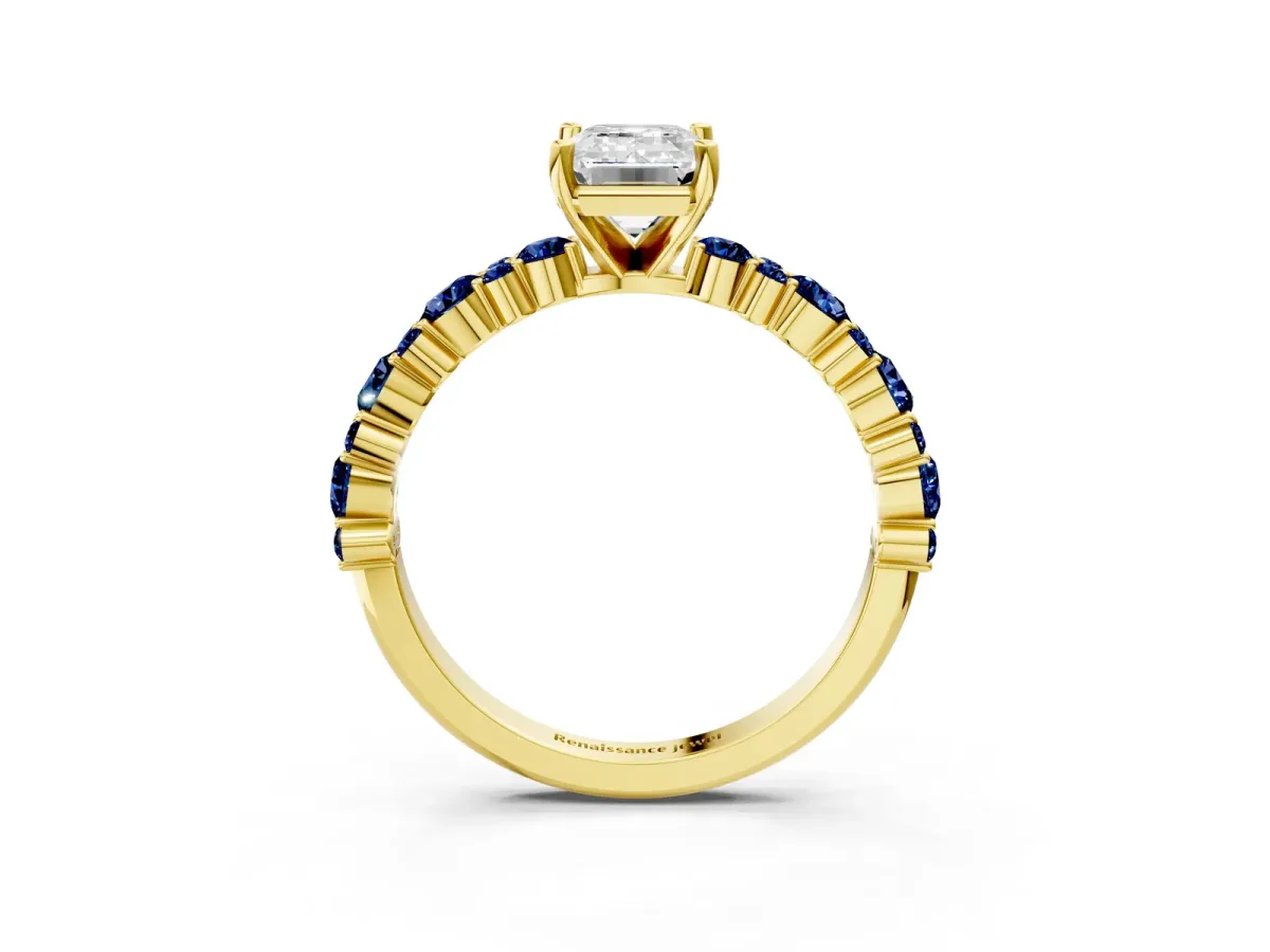 Emerald Cut Diamond Side Stone Solitaire Ring with Round Blue Sapphire and Four-Prong Setting Yellow gold