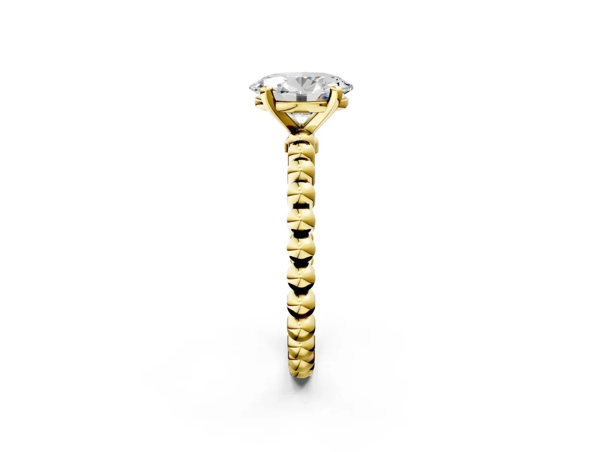 Oval Cut Diamond Solitaire Ring with Beaded Band and Prong Setting Yellow gold