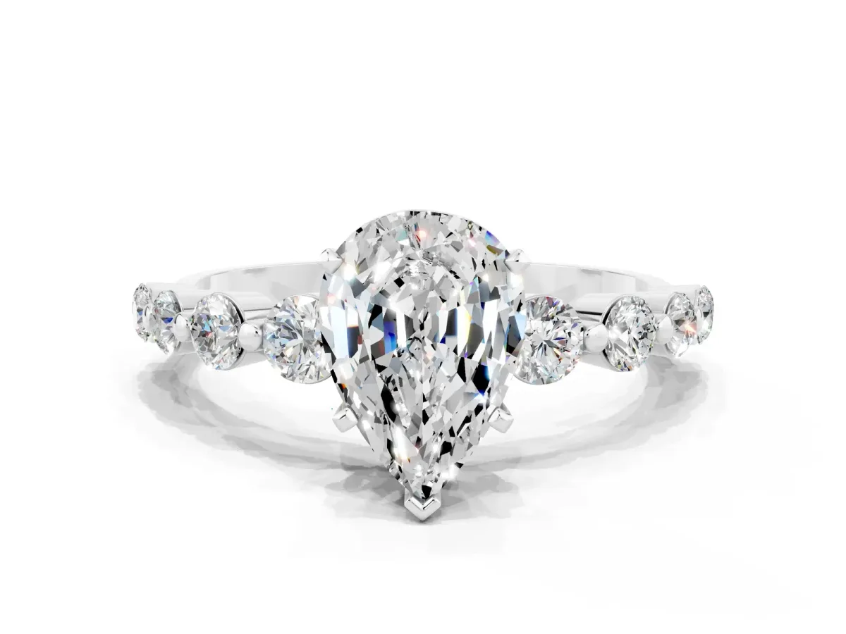 Pear Cut Solitaire Moissanite Ring with Pave Band and Four-Prong Setting Silver