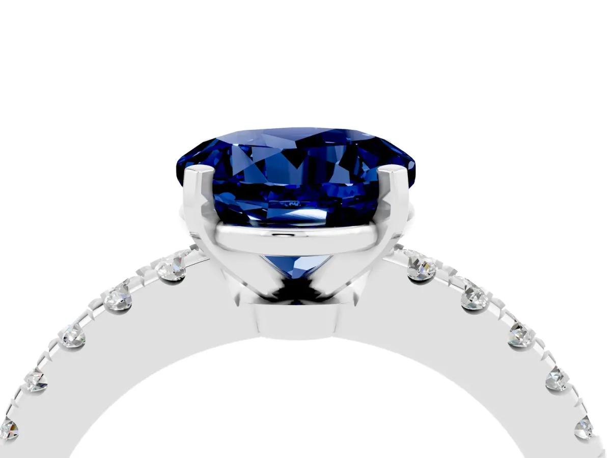 Round Cut Solitaire Blue Sapphire with Pavé Band and Four-Prong Setting Silver