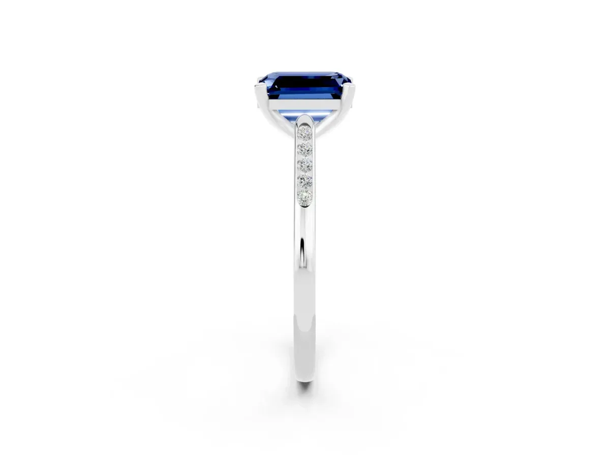 Emerald Cut Blue Sapphire Solitaire Ring with Channel Set Round Band and Prong Setting Silver