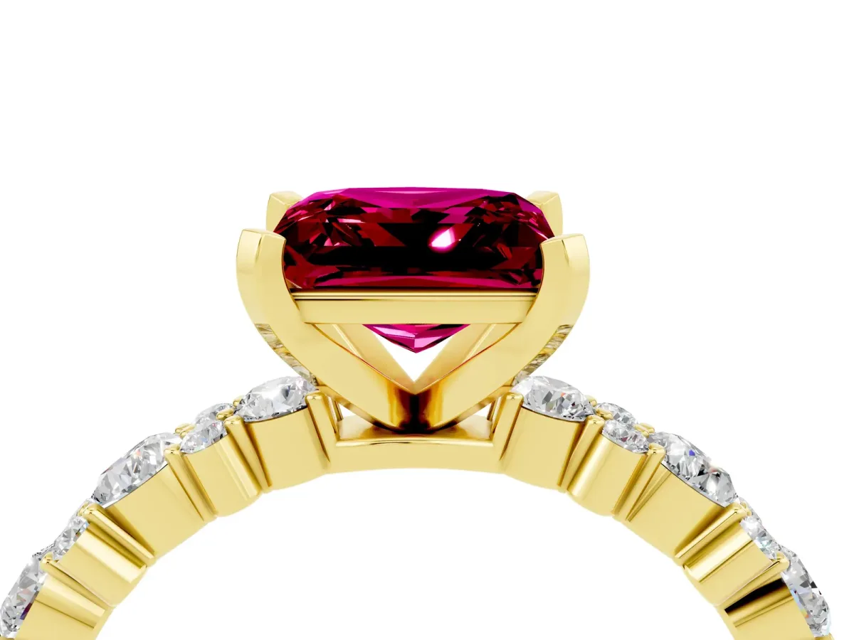 Princess Cut Garnet Side Stone Solitaire Ring with Round and Four-Prong Setting Yellow gold