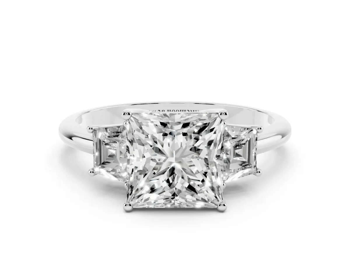 Princess Cut Diamond Three-Stone Ring with Trapezoid Side Stones and Prong Setting Platinum