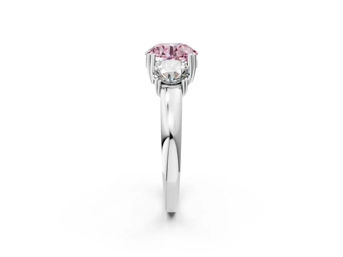 Fancy Pink Three-Stone Round Cut Cut Diamond Ring with Channel Set Band and Four-Prong Setting Silver