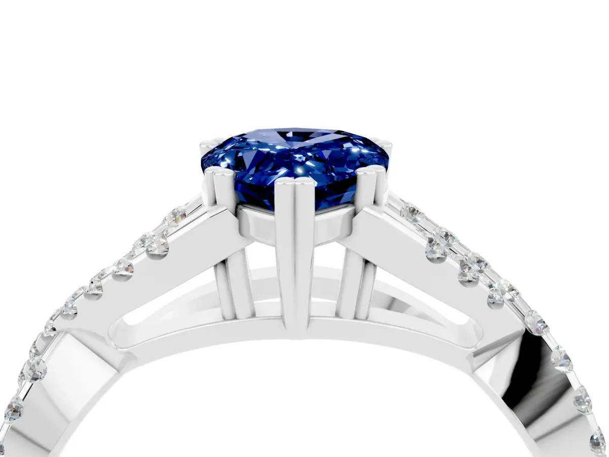 Pear Cut Blue Sapphire Solitaire Ring with Four-Prong Setting and Twisted Pavé Band Platinum