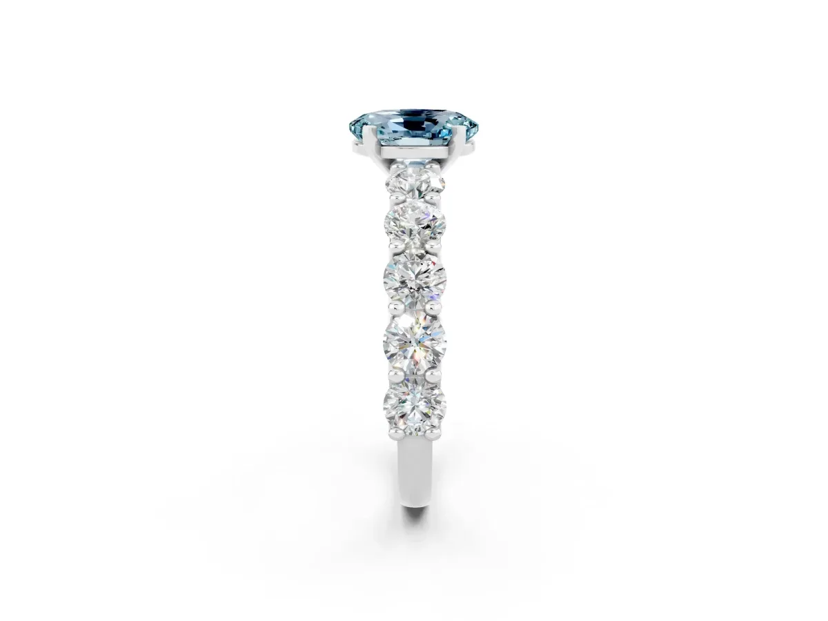 Oval Cut Aquamarine Prong Setting with Side Stones on a Pave Band Silver