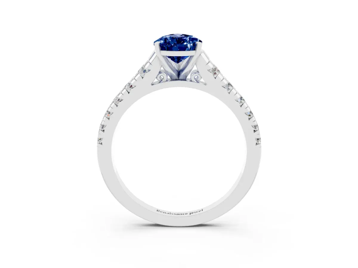 Pear Cut Blue Sapphire Cathedral Solitaire Ring with Round Pavé Band Silver