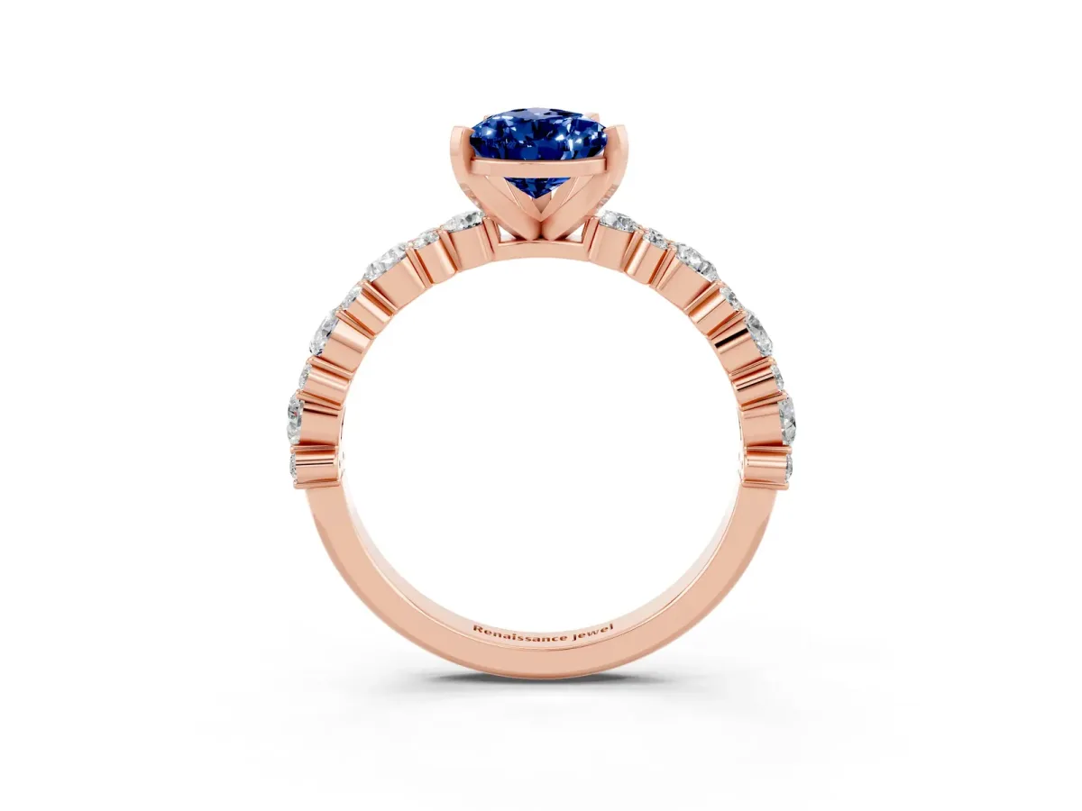 Pear Cut Blue Sapphire Side Stone Solitaire Ring with Round and Four-Prong Setting Rose gold