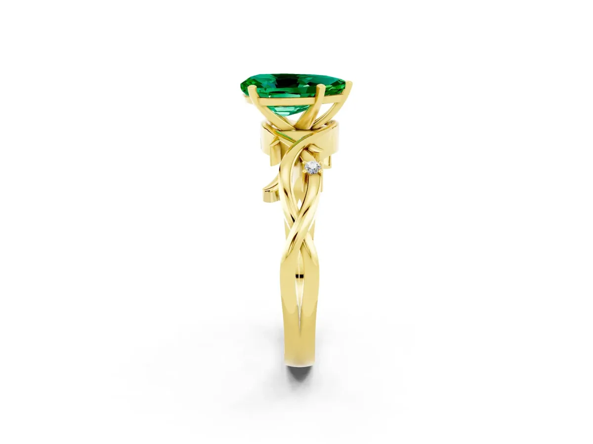 Pear Cut Emerald Solitaire Ring with Twisted Band and Prong Setting Yellow gold