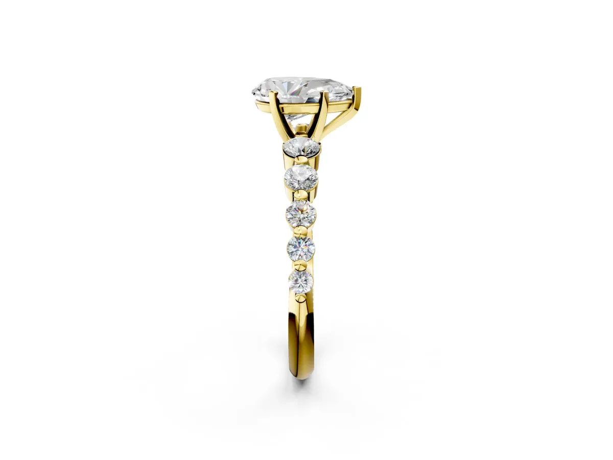 Pear Cut Solitaire Diamond Ring with Pave Band and Four-Prong Setting Yellow gold