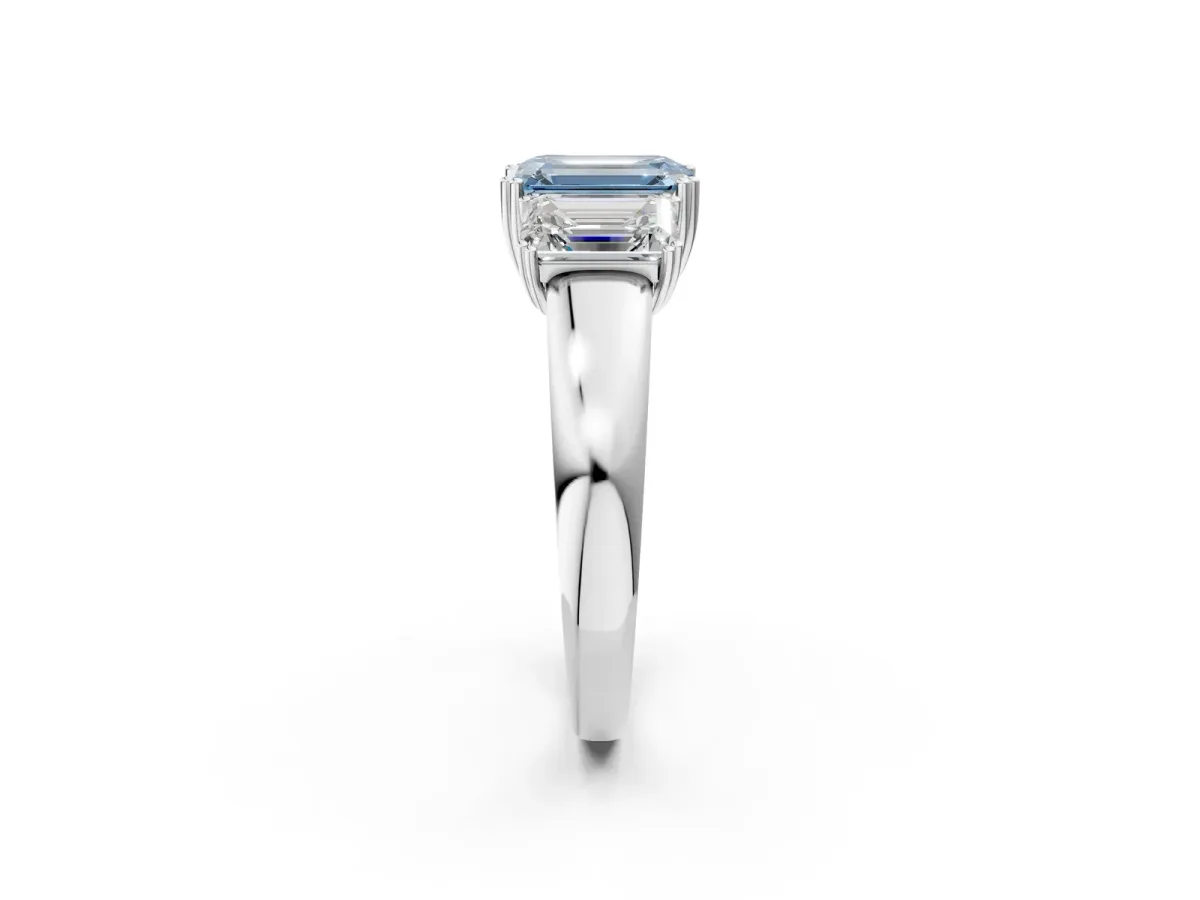 Fancy Blue Three-Stone Emerald Cut Cut Diamond Ring with Channel Set Band and Four-Prong Setting Silver