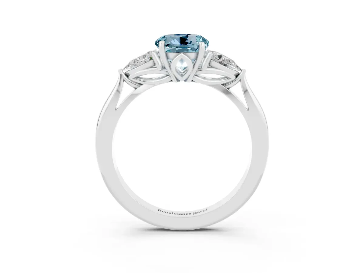 Three-Stone Round Cut Aquamarine Ring with Pear Side Stones in Four-Prong Setting Platinum