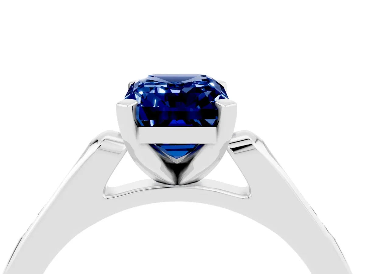 Emerald Cut Blue Sapphire Solitaire Ring with Channel Set Round Band and Prong Setting Silver