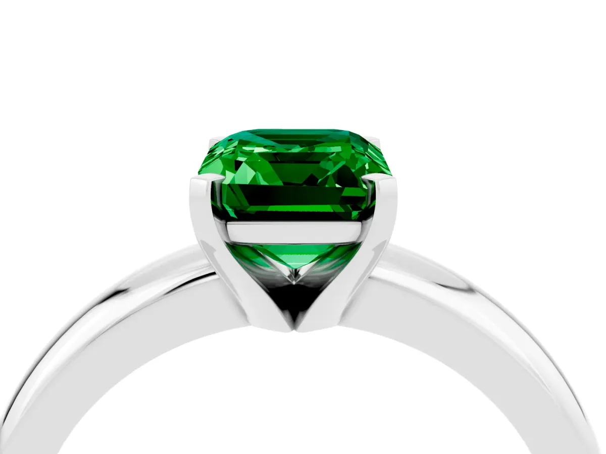 Emerald Cut Emerald Solitaire Engagement Ring with Round Band and Four-Prong Setting Platinum