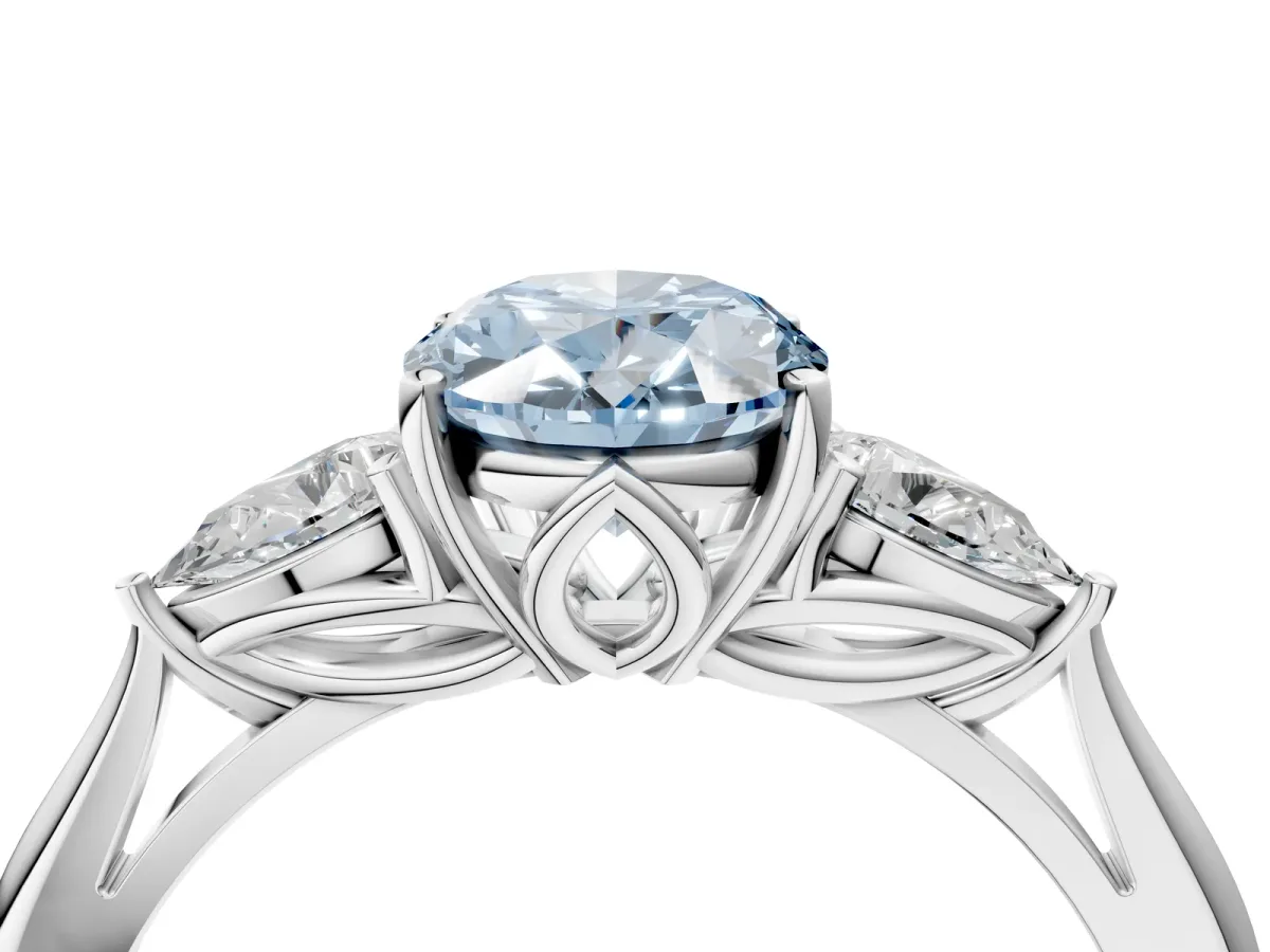 Fancy Blue Three-Stone Oval Cut Diamond Ring with Pear Side Stones in Four-Prong Setting White gold