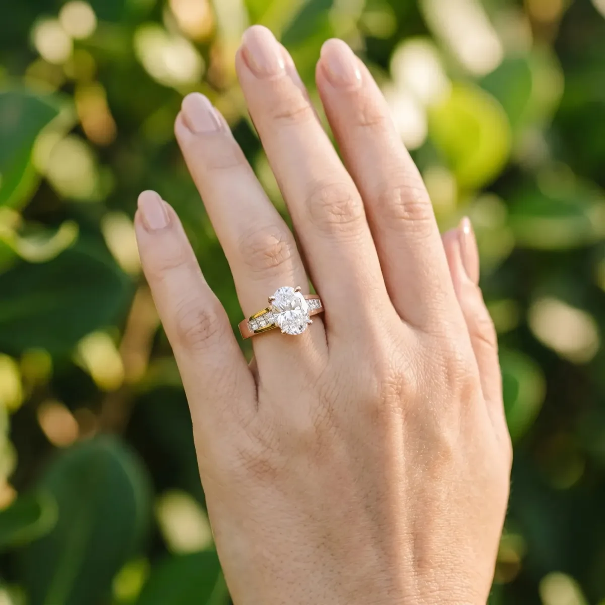 Oval Cut Cut Channel Set Solitaire Ring with Four-Prong Setting Rose gold