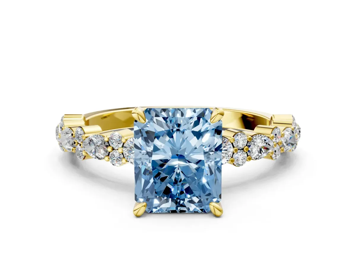 Fancy Blue Radiant Cut Diamond Side Stone Solitaire Ring with Round and Four-Prong Setting Yellow gold