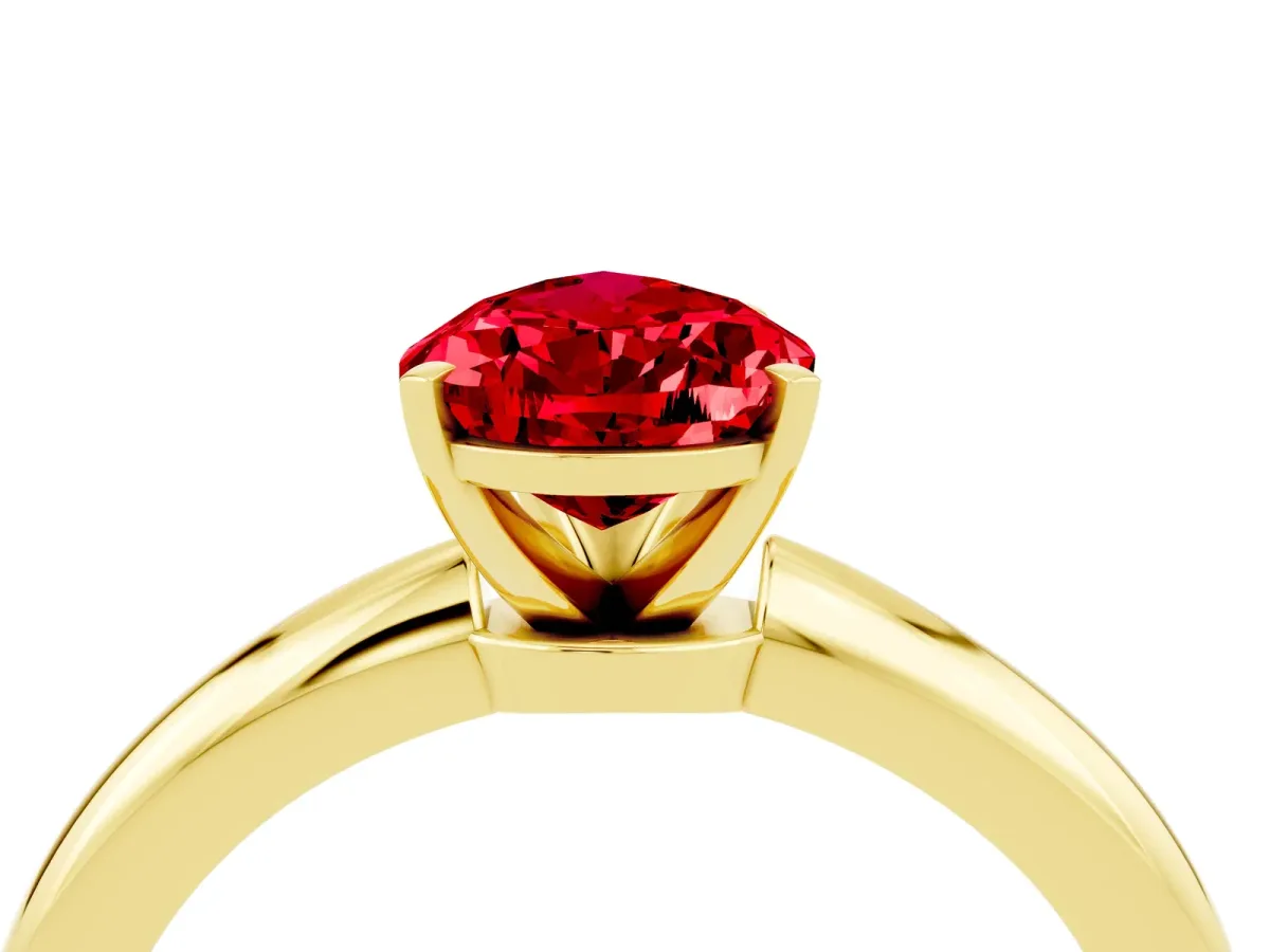 Pear Cut Ruby Solitaire Ring with Six-Prong Setting and Classic Band Yellow gold