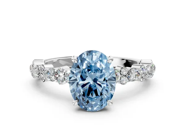 Fancy Blue Oval Cut Diamond Side Stone Solitaire Ring with Round and Four-Prong Setting White gold