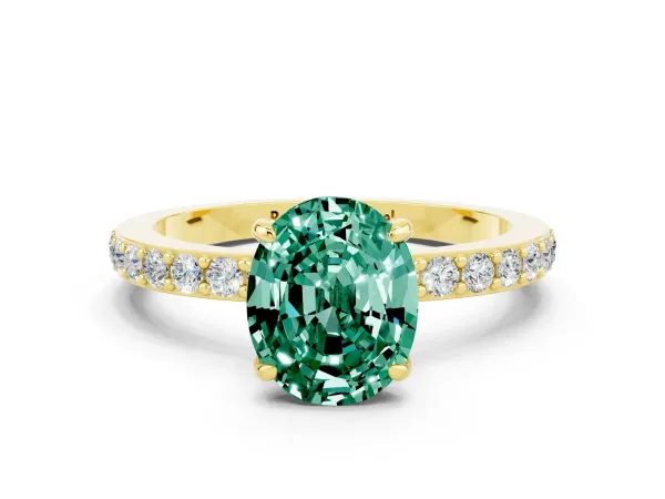Oval Cut Green Sapphire Solitaire Engagement Ring with Pavé Band and Four-Prong Setting Yellow gold