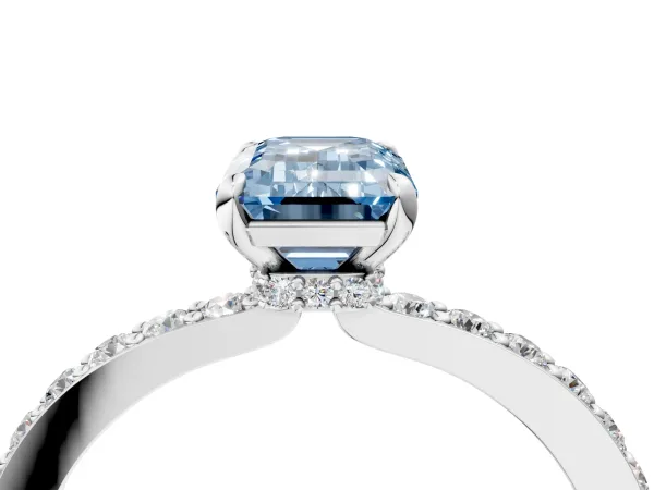 Fancy Blue Emerald Cut Diamond Solitaire Engagement Ring with Pavé Band and Four-Prong Setting Silver