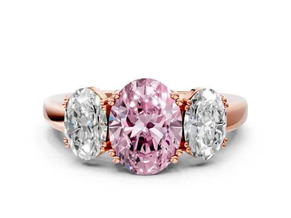 Fancy Pink Three-Stone Oval Cut Cut Diamond Ring with Channel Set Band and Four-Prong Setting Rose gold