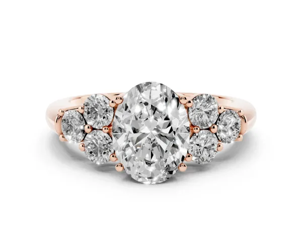Oval Cut Cut Diamond Cluster Ring with Round Accent Stones and Prong Setting on a Classic Band Rose gold