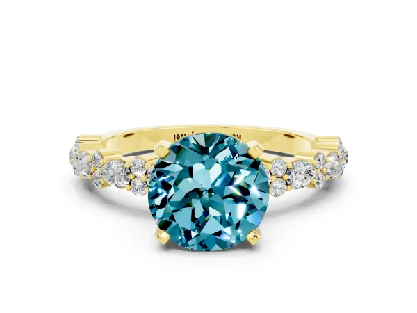 Round Cut Blue Topaz Side Stone Solitaire Ring with Round and Four-Prong Setting Yellow gold