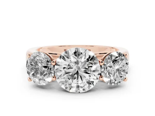 Round Cut Three-Stone Diamond Ring with Prong Setting on a Classic Band Rose gold