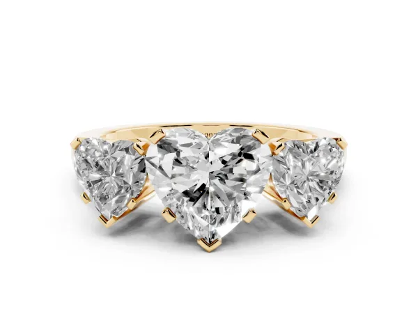 Three-Stone Heart Cut Cut Diamond Ring with Channel Set Band and Four-Prong Setting Yellow gold