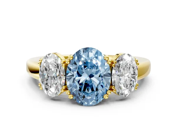 Fancy Blue Three-Stone Oval Cut Cut Diamond Ring with Channel Set Band and Four-Prong Setting Yellow gold