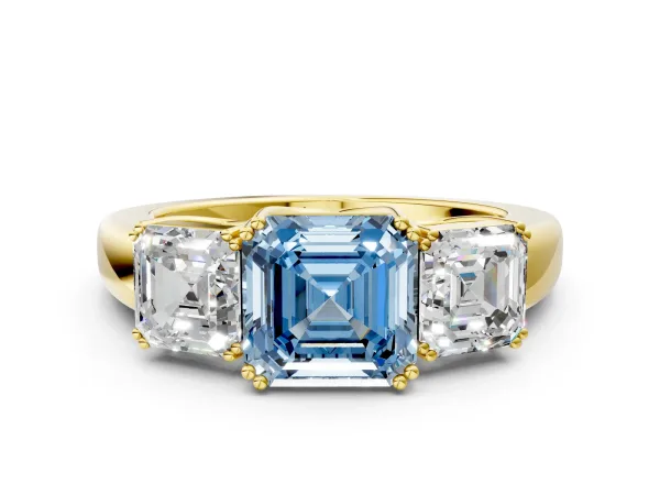 Fancy Blue Three-Stone Asscher Cut Cut Diamond Ring with Channel Set Band and Four-Prong Setting Yellow gold
