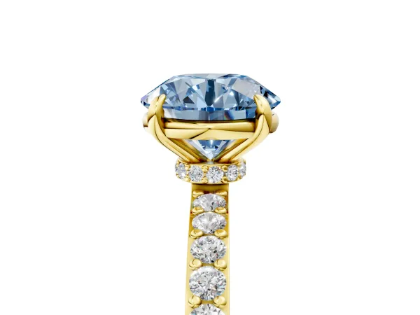 Fancy Blue Round Cut Diamond Solitaire Engagement Ring with Pavé Band and Four-Prong Setting Yellow gold