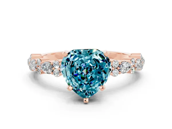 Heart Cut Blue Topaz Side Stone Solitaire Ring with Round and Four-Prong Setting Rose gold