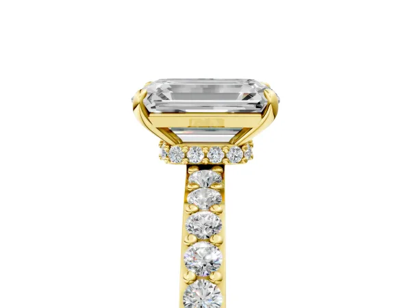 Emerald Cut Diamond Solitaire Engagement Ring with Pavé Band and Four-Prong Setting Yellow gold