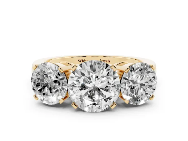 Three-Stone Round Cut Cut Diamond Ring with Channel Set Band and Four-Prong Setting Yellow gold