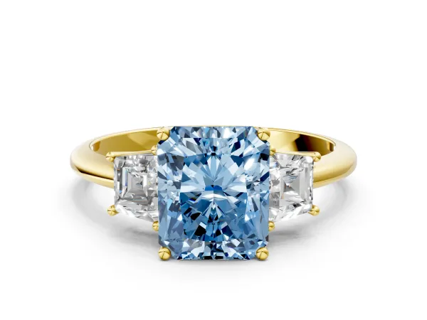 Fancy Blue Radiant Cut Diamond Three-Stone Ring with Trapezoid Side Stones and Prong Setting Yellow gold