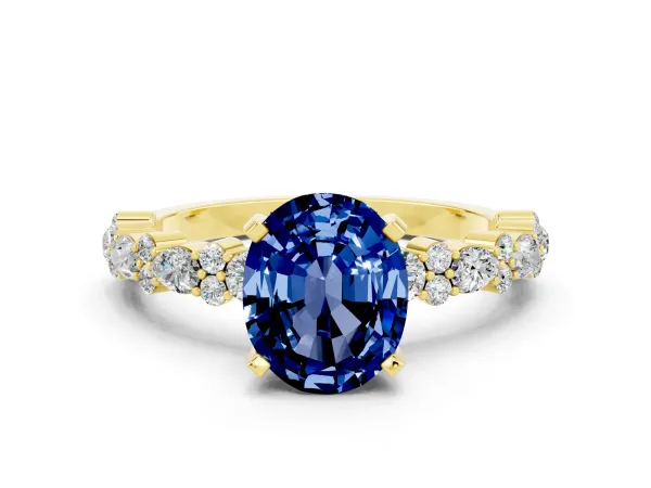 Oval Cut Blue Sapphire Side Stone Solitaire Ring with Round and Four-Prong Setting Yellow gold